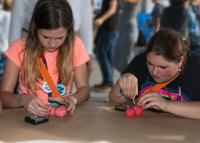 Participants use conductive dough to create circuits at the International Maker Fair
