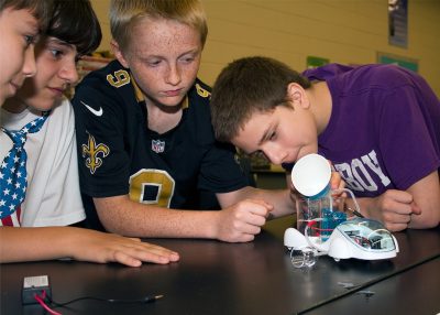 4-H members Investigate the principles of a hydrogen powered vehicle.