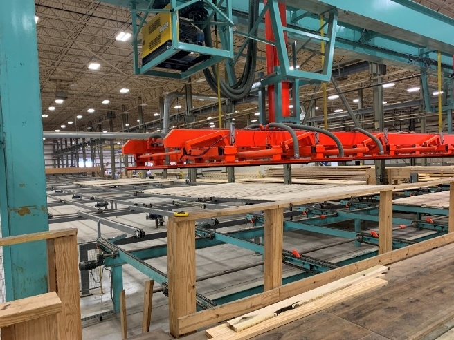 Machine that shows how lumber is staked to apply glue